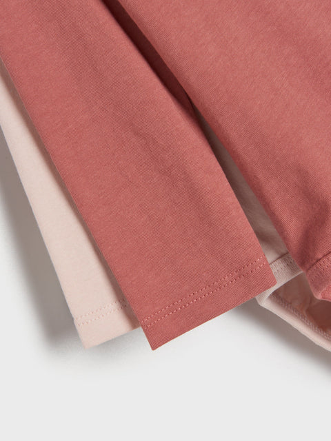 Close-up of a folded pink fabric on a white background