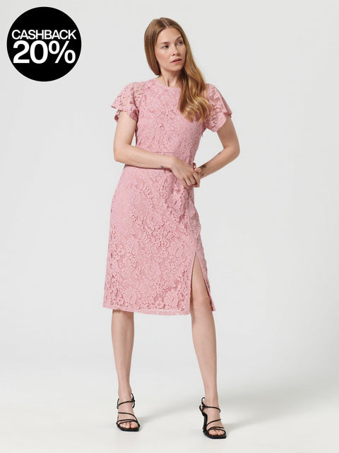 Woman wearing a pink lace dress on a white background
