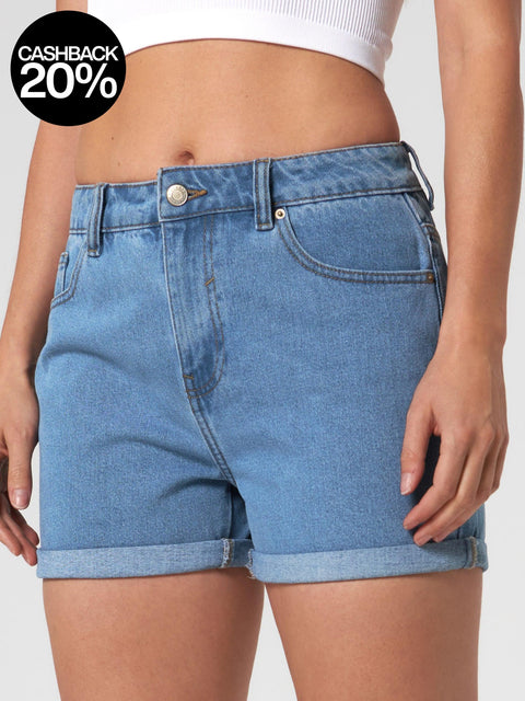 Blue denim shorts worn by a person on a white background