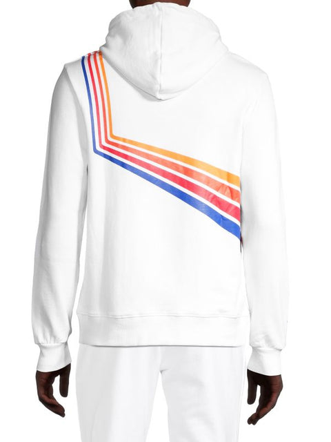White hoodie with colorful geometric pattern on the back, worn by a person.