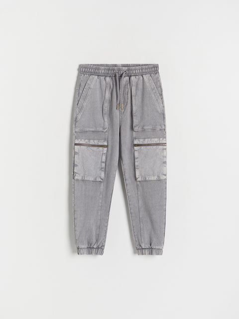 Gray jogger pants with multiple pockets on a white background