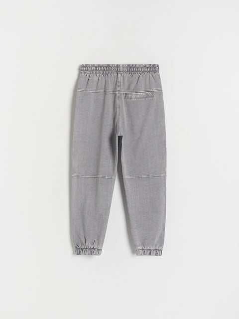 Gray jogger pants on a white background