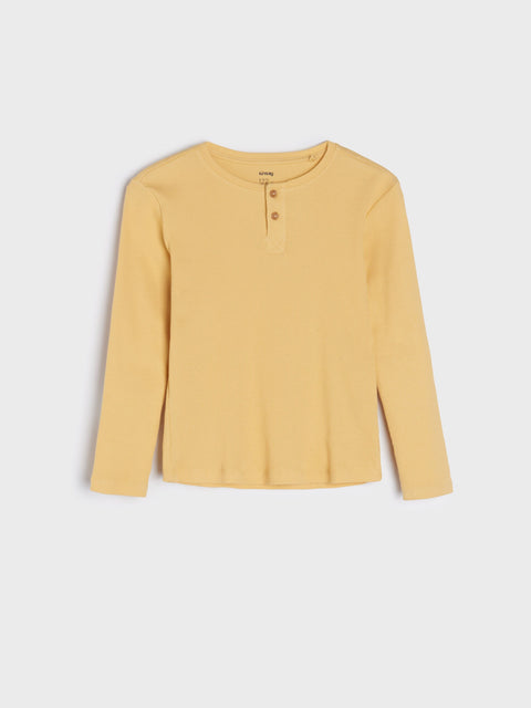 Yellow long-sleeve shirt on a light gray background
