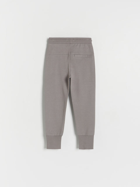Gray sweatpants on a light gray background