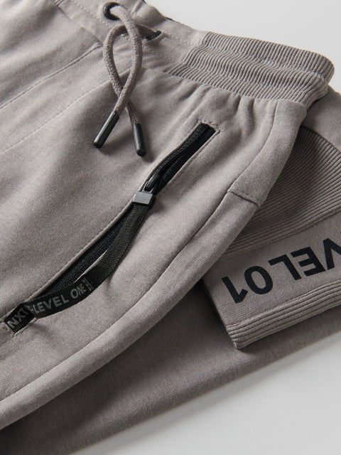 Gray sweatpants with a brand logo on a white background