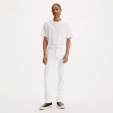 Person wearing a white t-shirt and white pants on a plain background