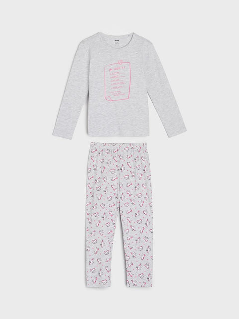 Children's pajama set with long-sleeve top and patterned pants on a white background