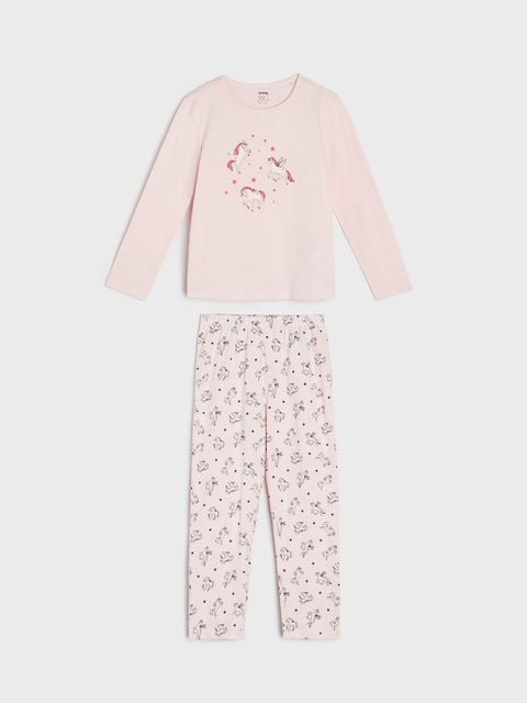 Pink pajama set with long-sleeve top and patterned pants on a white background