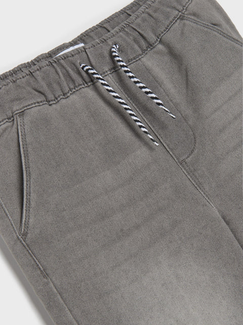 Gray pants with a striped drawstring on a light gray background