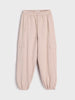Beige sweatpants on a light gray background