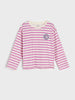 Pink and white striped long-sleeve shirt with a logo on a light gray background