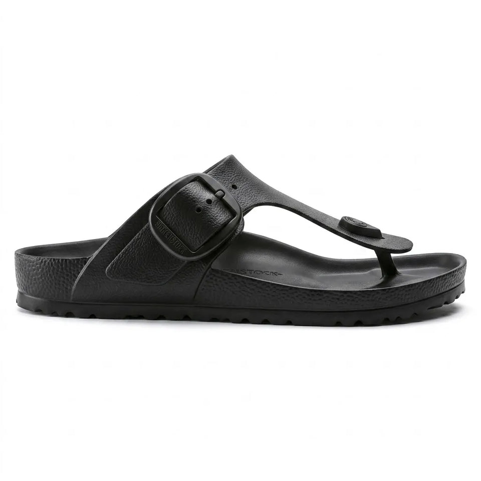 A metallic silver double-strap slide sandal with adjustable buckles, a cork-textured footbed, and a black outsole, shown in a side profile on a white background.