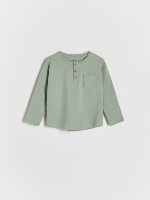 Green long-sleeve shirt on a white background