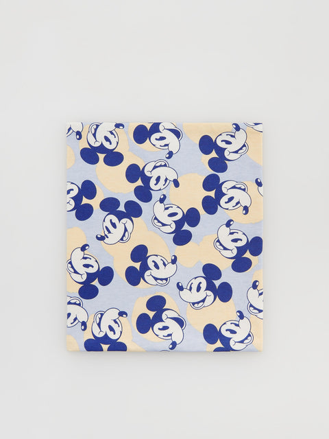 Patterned fabric with repeated design on a light gray background