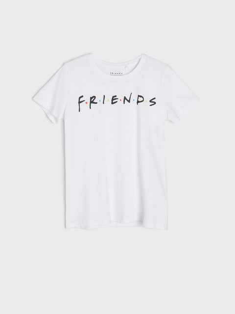 White t-shirt with 'FRIENDS' text on a white background