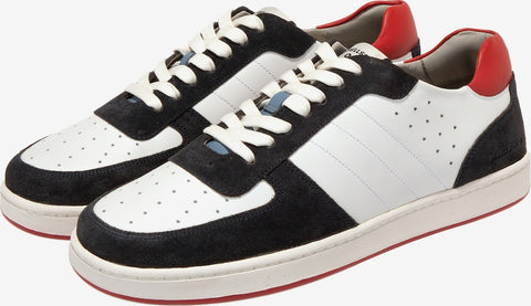 Pair of black, white, and red sneakers on a white background