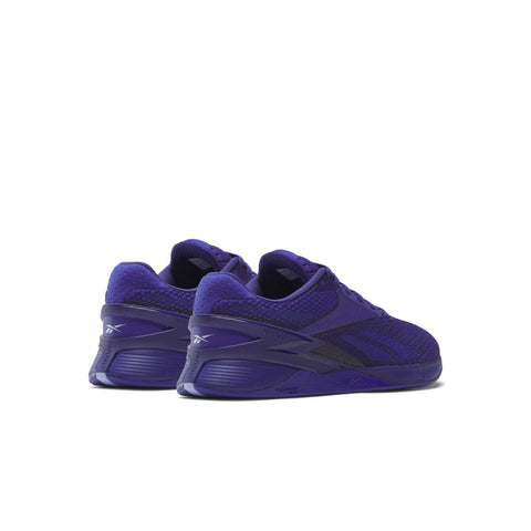 Pair of purple athletic shoes on a white background