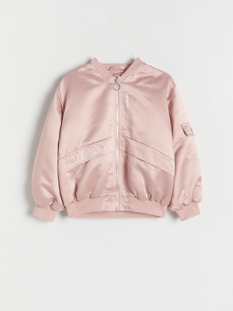 Pink bomber jacket on a light gray background