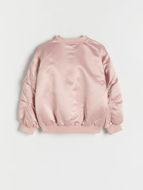 Pink satin bomber jacket on a light gray background