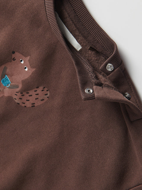 Brown children's outfit with a fox design on a white background