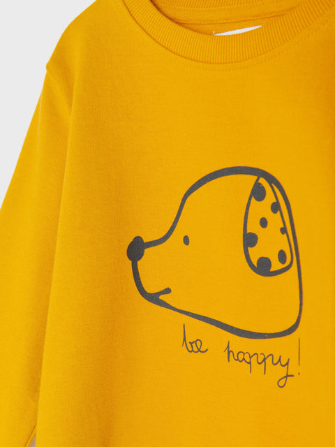 Yellow sweatshirt with a black dog illustration and 'be happy!' text on a white background