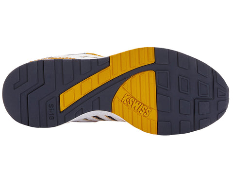 Sole of a sneaker with yellow and black sole and brand name on a white background