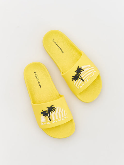 Yellow slides with palm tree design on a white background