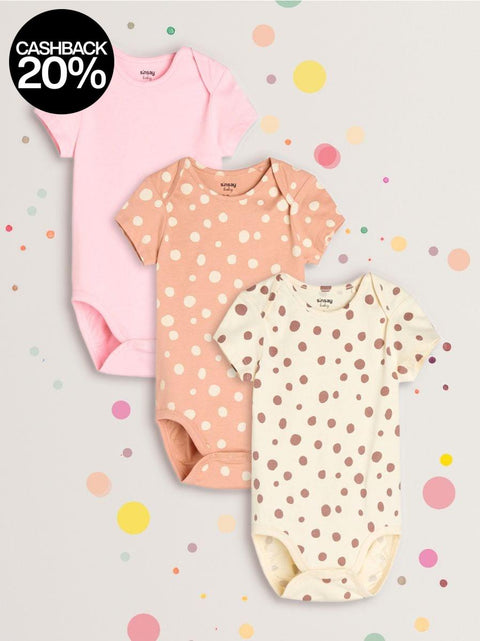 Three baby bodysuits with polka dot patterns on a light gray background with colorful dots.