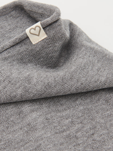 Gray fabric with a heart-shaped label on a white background