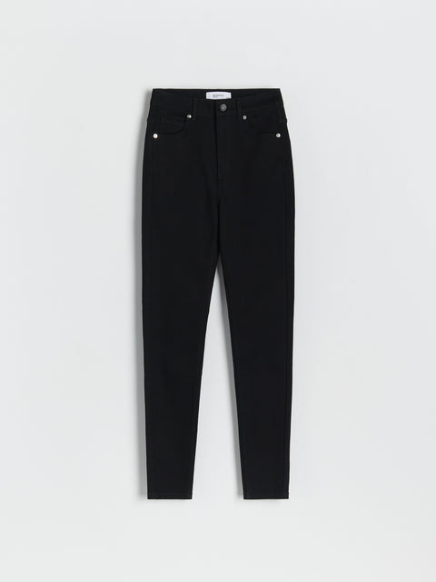Black jeans on a light gray background