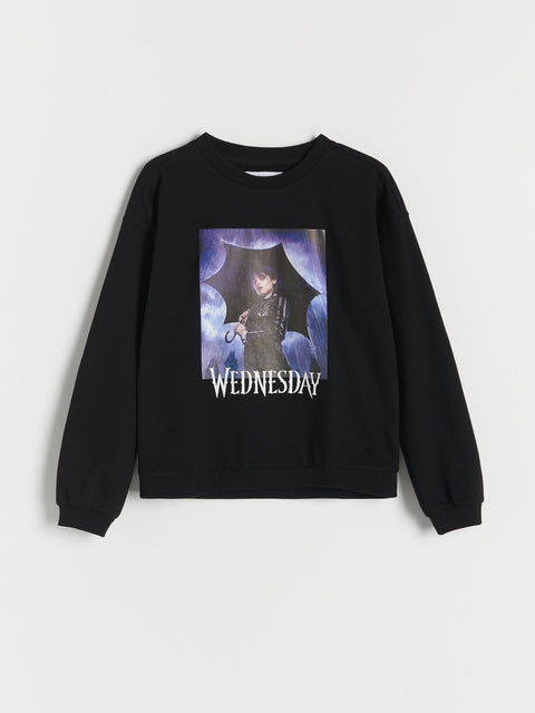 Black sweatshirt with a graphic of a character holding an umbrella and the word 'Wednesday' on a white background.