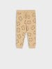 Beige sweatpants with black cat pattern on a white background