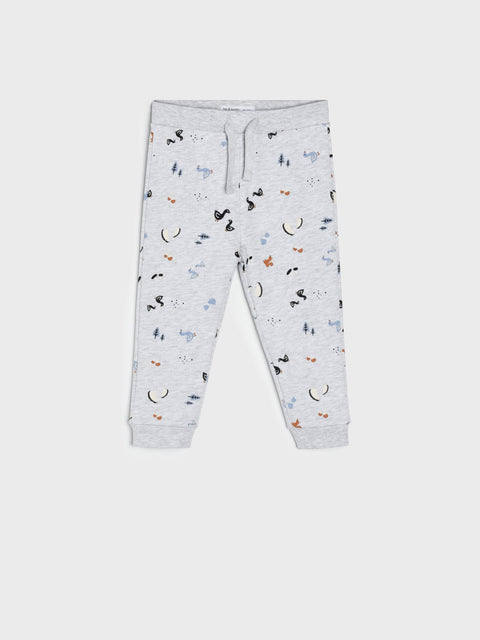 Gray jogger pants with colorful patterns on a white background