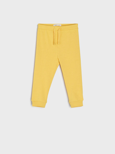 Yellow sweatpants on a white background