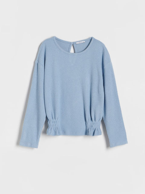Light blue ribbed blouse on a white background