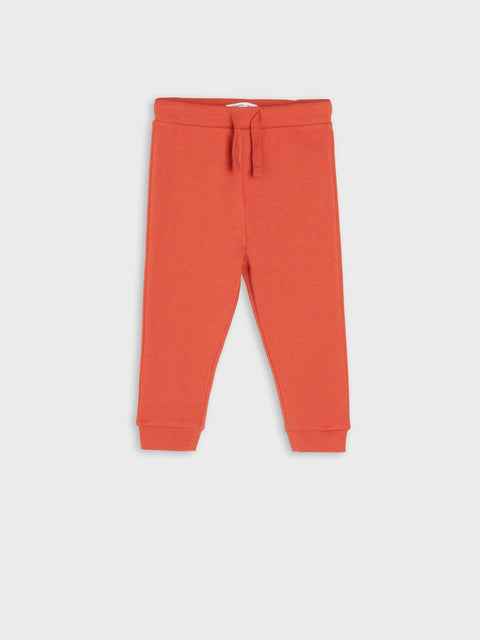 Red pants with a drawstring on a white background