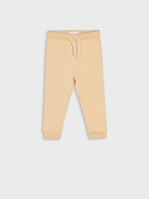 Beige sweatpants on a white background