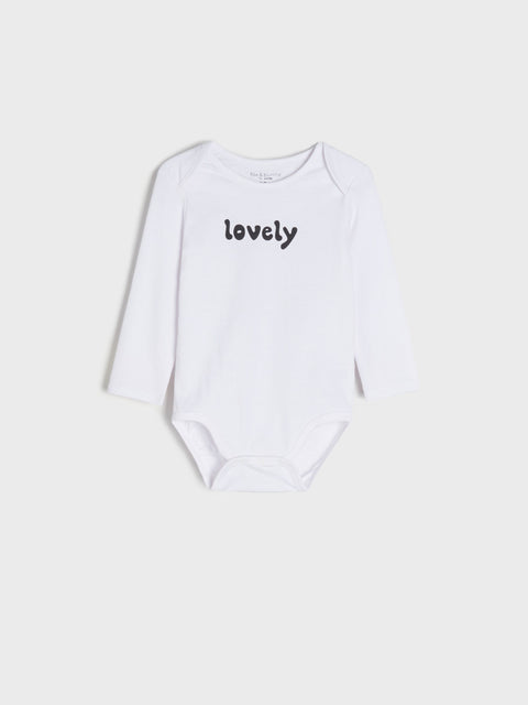 White baby onesie with 'lovely' text on a light gray background