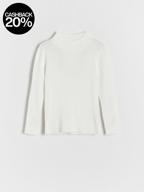 White ribbed sweater on a light gray background