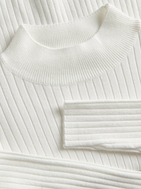 Close-up of a white ribbed knit sweater on a white background