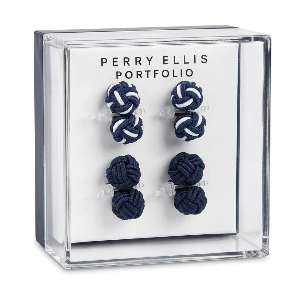 Six navy blue and white knotted cord jewelry pieces displayed inside a clear acrylic Perry Ellis Portfolio box on a white backing card.