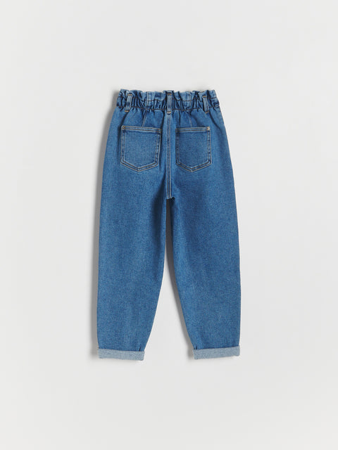Blue jeans on a light gray background