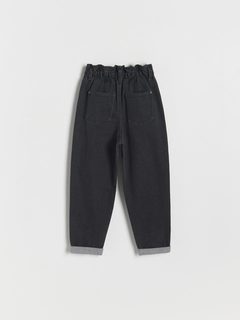 Black pants on a light gray background