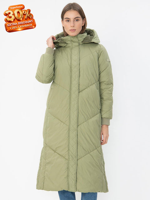 Woman wearing a green puffer coat on a white background