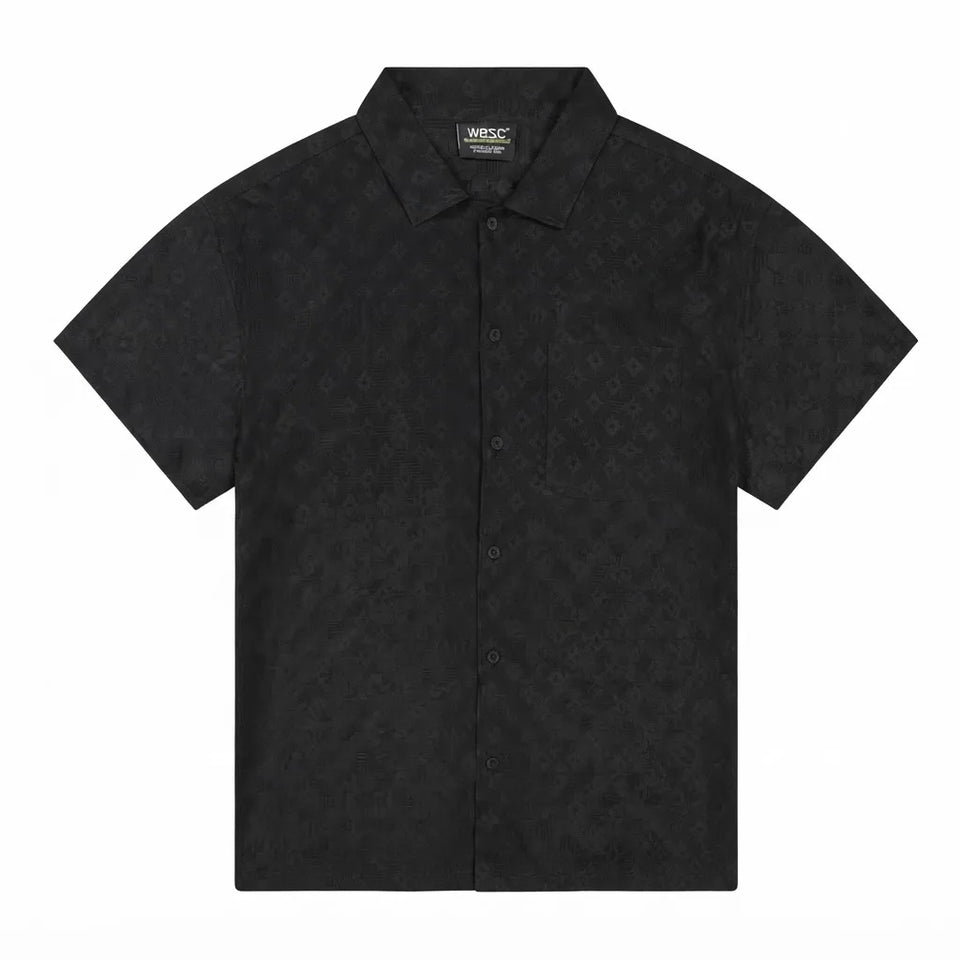 A black short-sleeve button-up shirt with an all-over tonal monogram pattern, displayed flat against a solid white background.