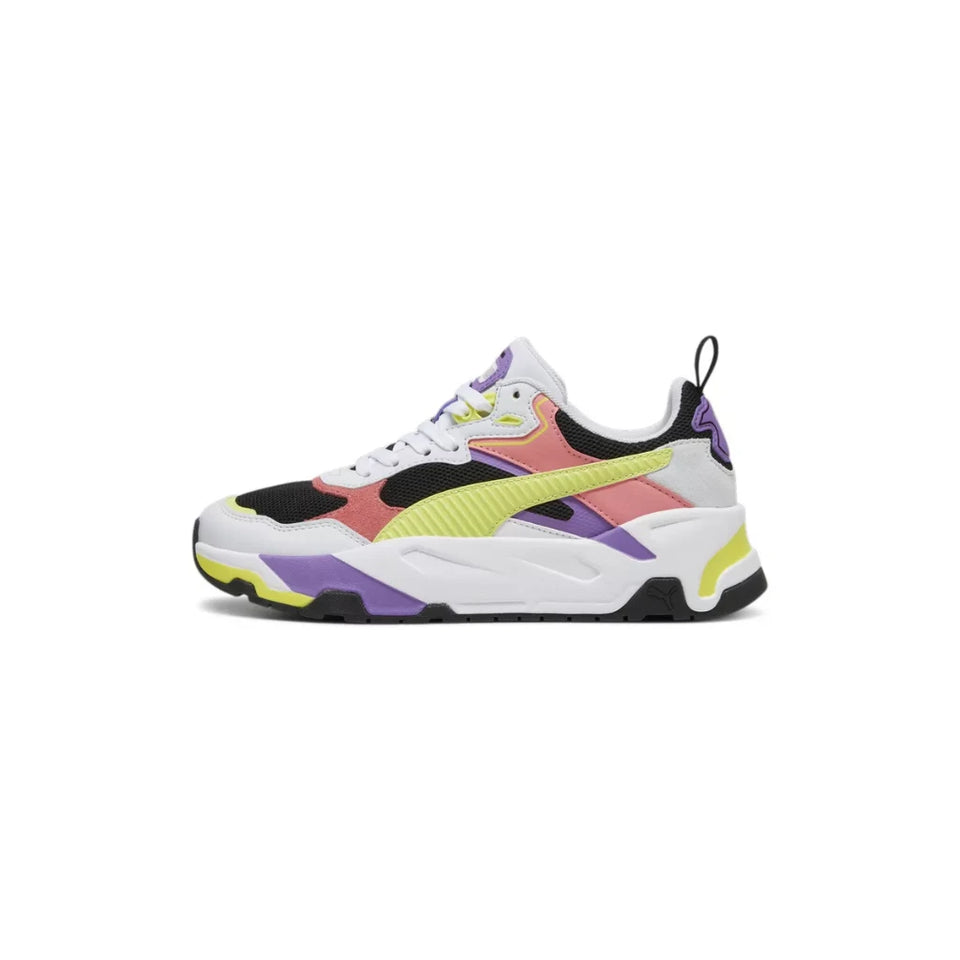 A multicolor chunky sneaker with white, pink, purple, black, and neon yellow panels, shown from a side profile on a white background.
