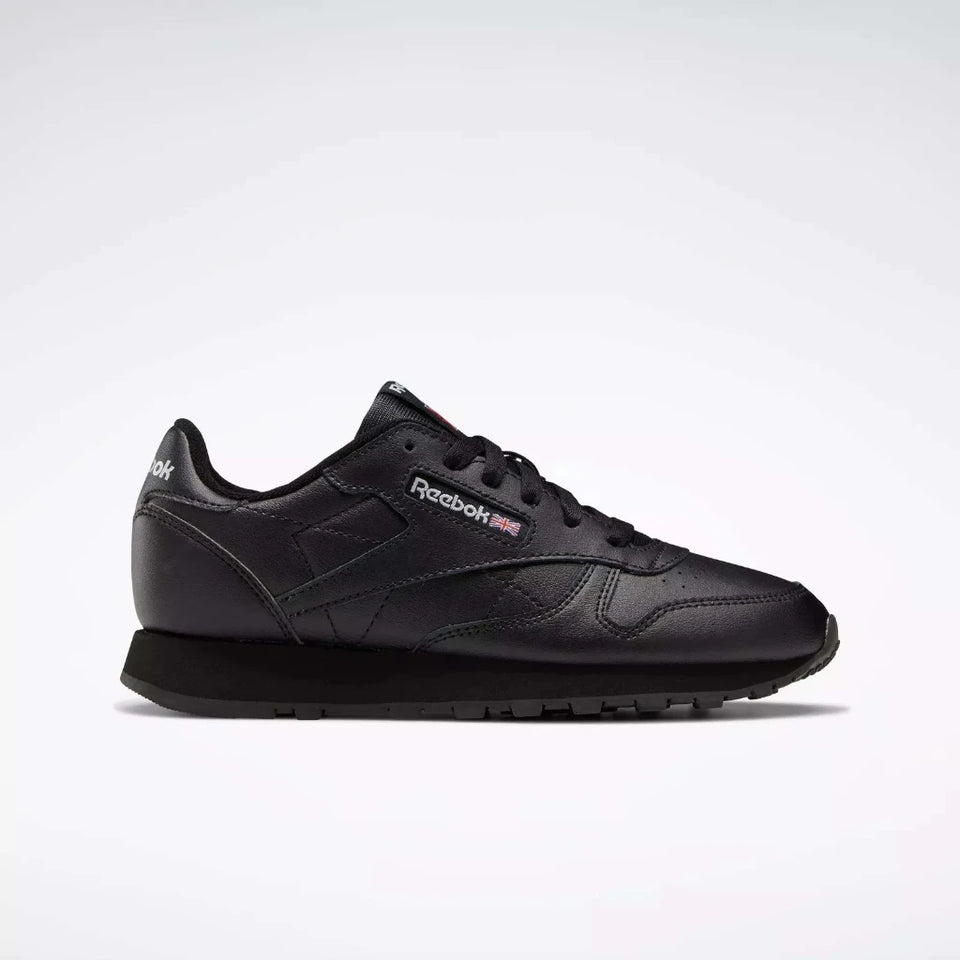 Black Reebok sneaker on a white background