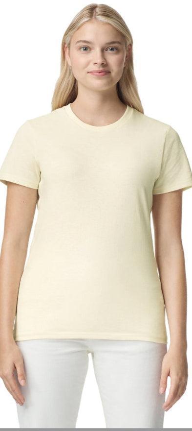 Woman wearing a light yellow t-shirt and white pants on a website homepage.