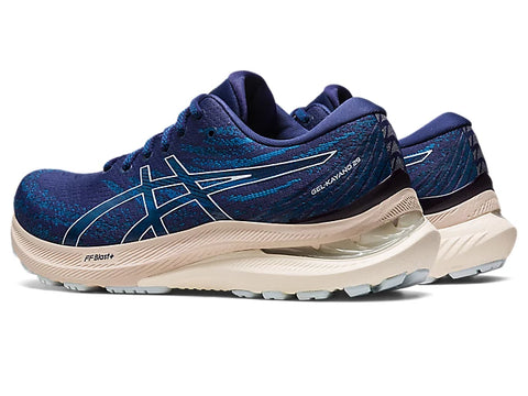 Blue running shoes with white sole on a white background