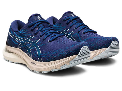 Blue running shoes with white soles on a white background